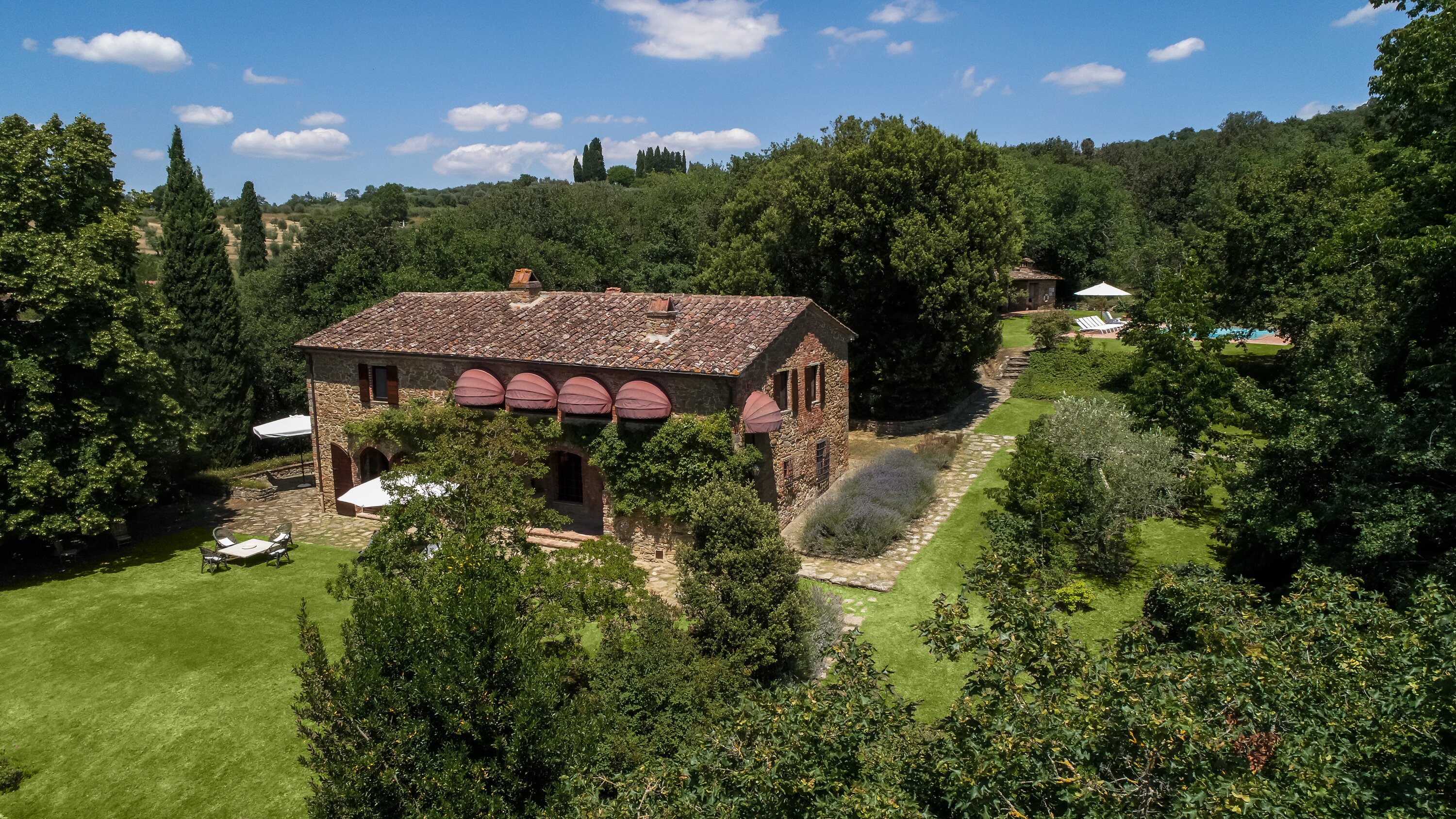 The house with the pool area behind