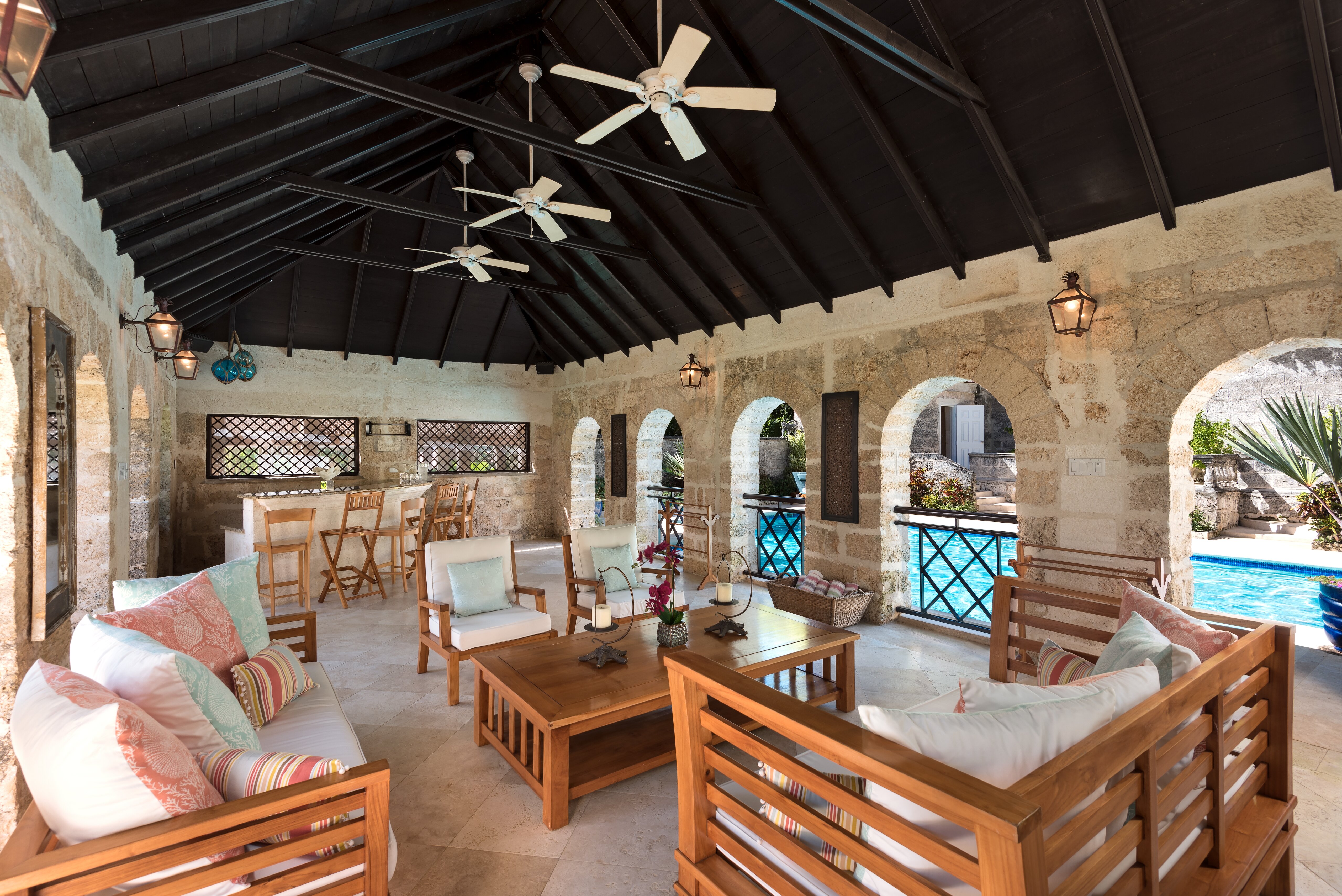 Pool loggia with soft seating and bar area
