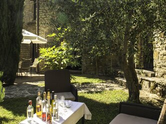 Soft seating in courtyard - Casa del Contadino visible in distance