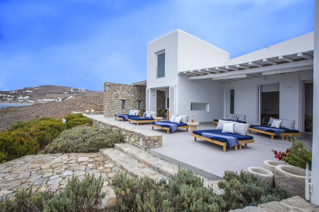 Panoramic seating area outside villa