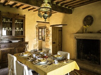 Casa del Prete - kitchen area opening via steps to gardens or to paved area in courtyard