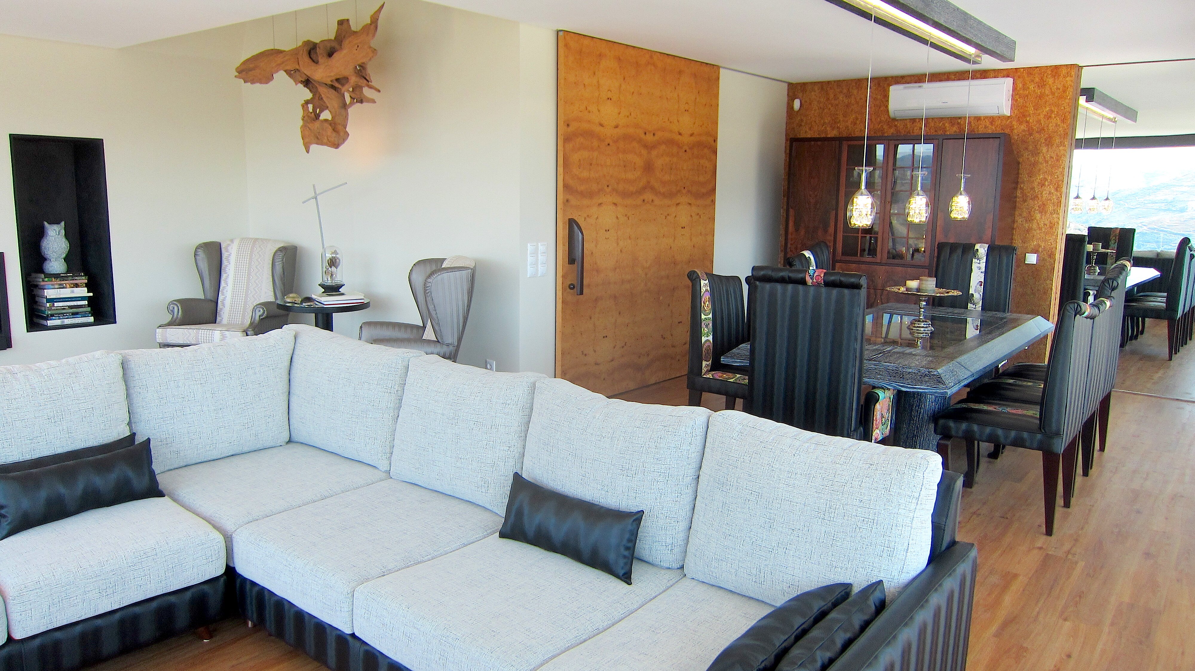 Open plan sitting room with TV and dining area