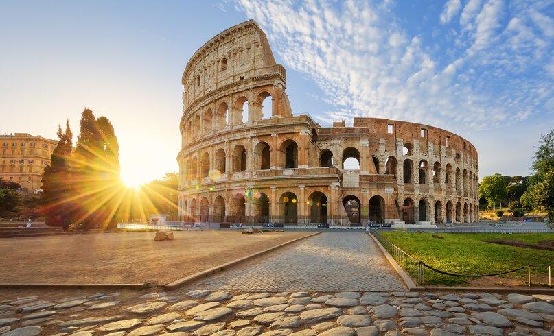 View of Colosseum in Rome and morning sun, Italy, Europe.