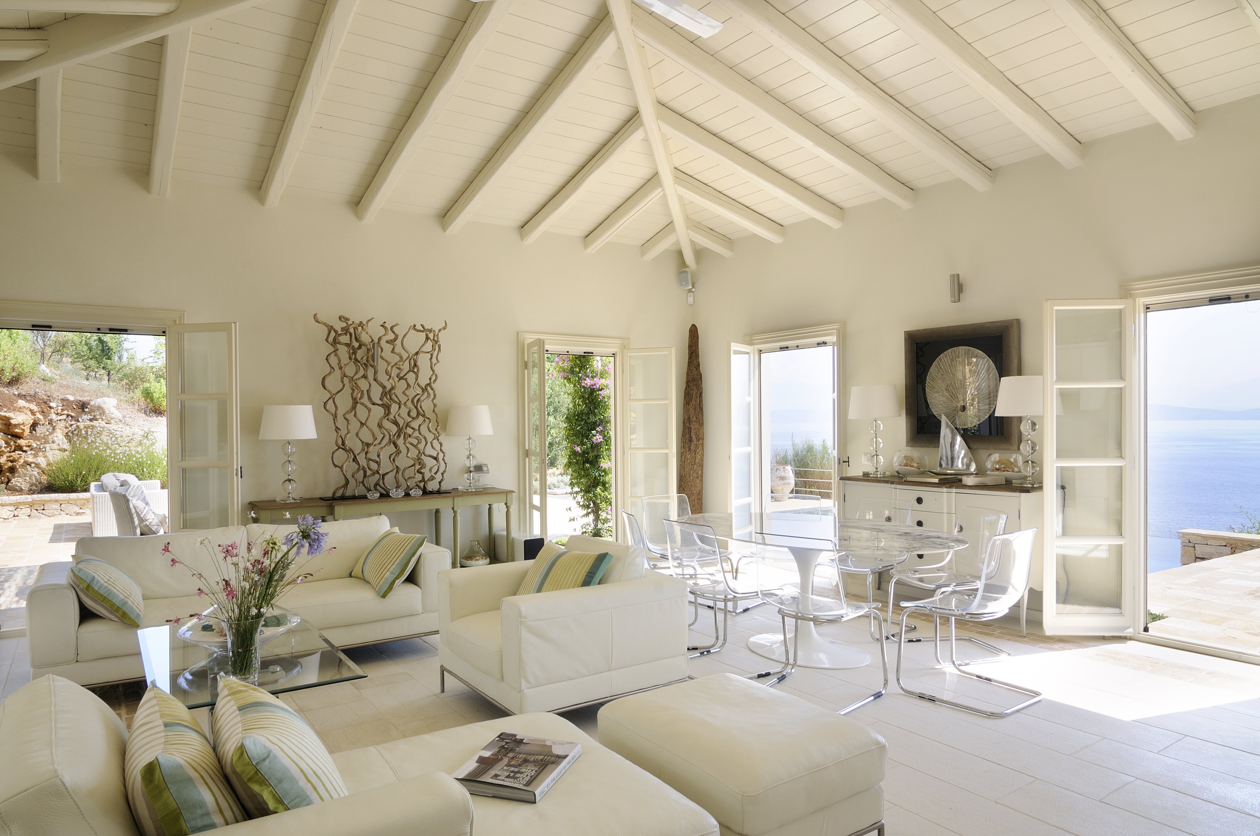 Large open plan sitting room and dining area, leading to terrace