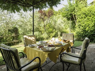 Wisteria covered pergola for guests at Il Forno