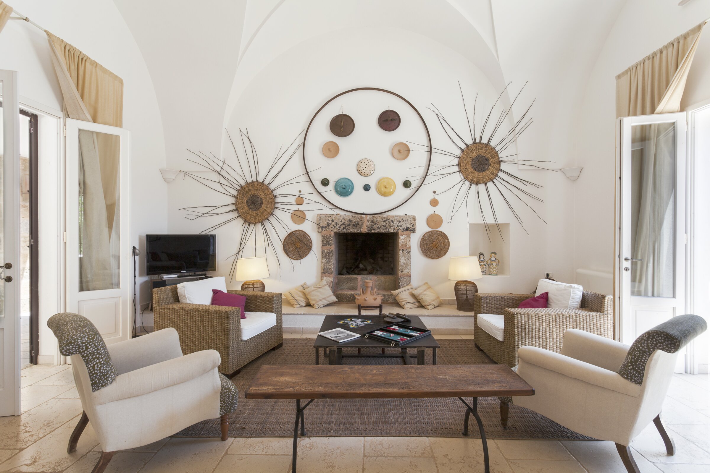 Sitting room opening to front and rear terraces