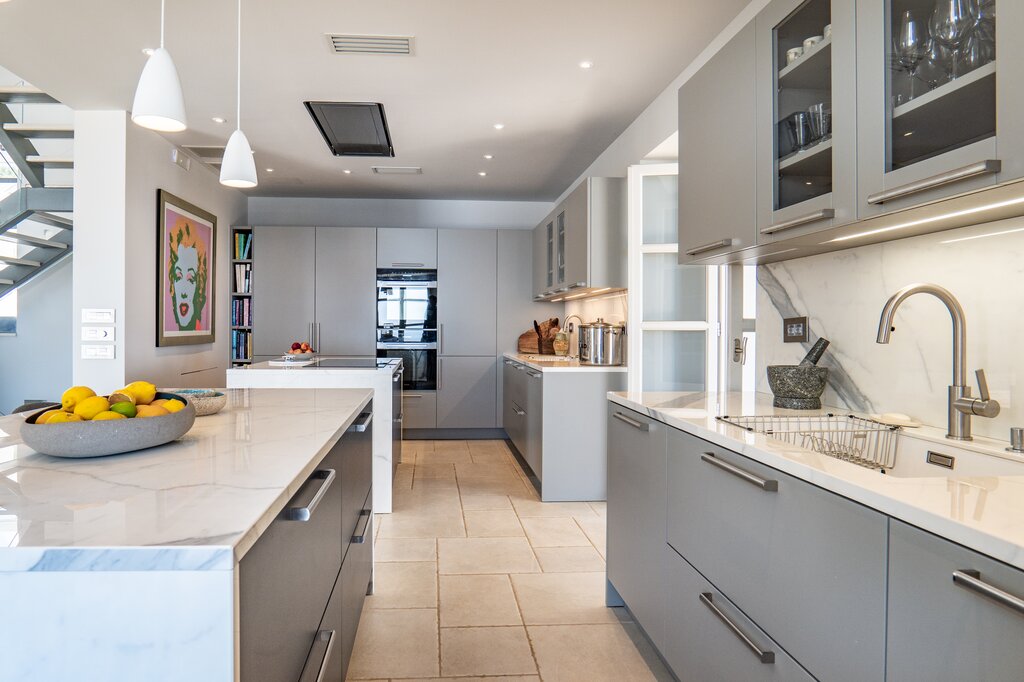 Open plan kitchen and living area opening to terrace