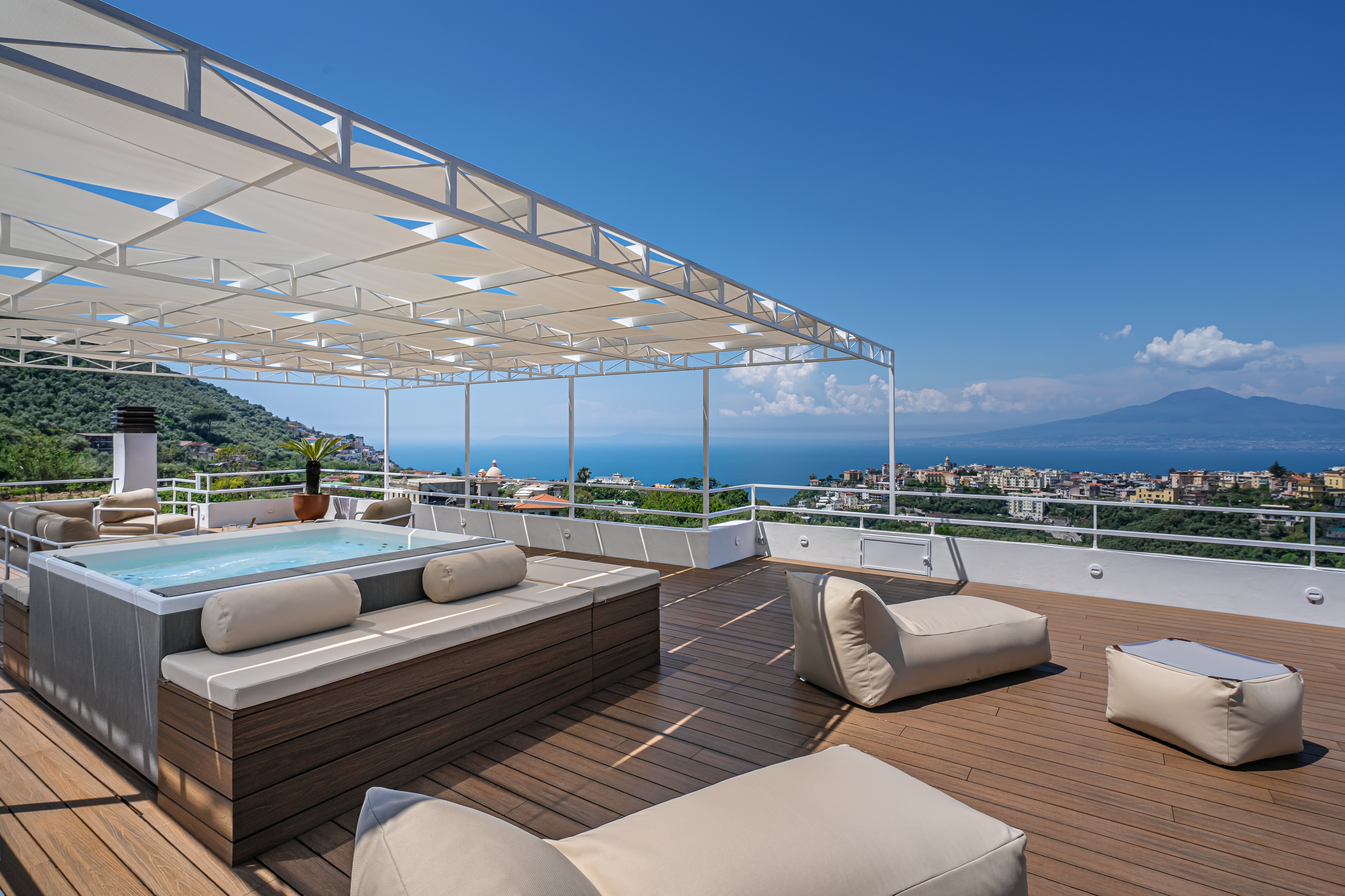 Roof terrace with heated Jacuzzi and areas in sun and shade