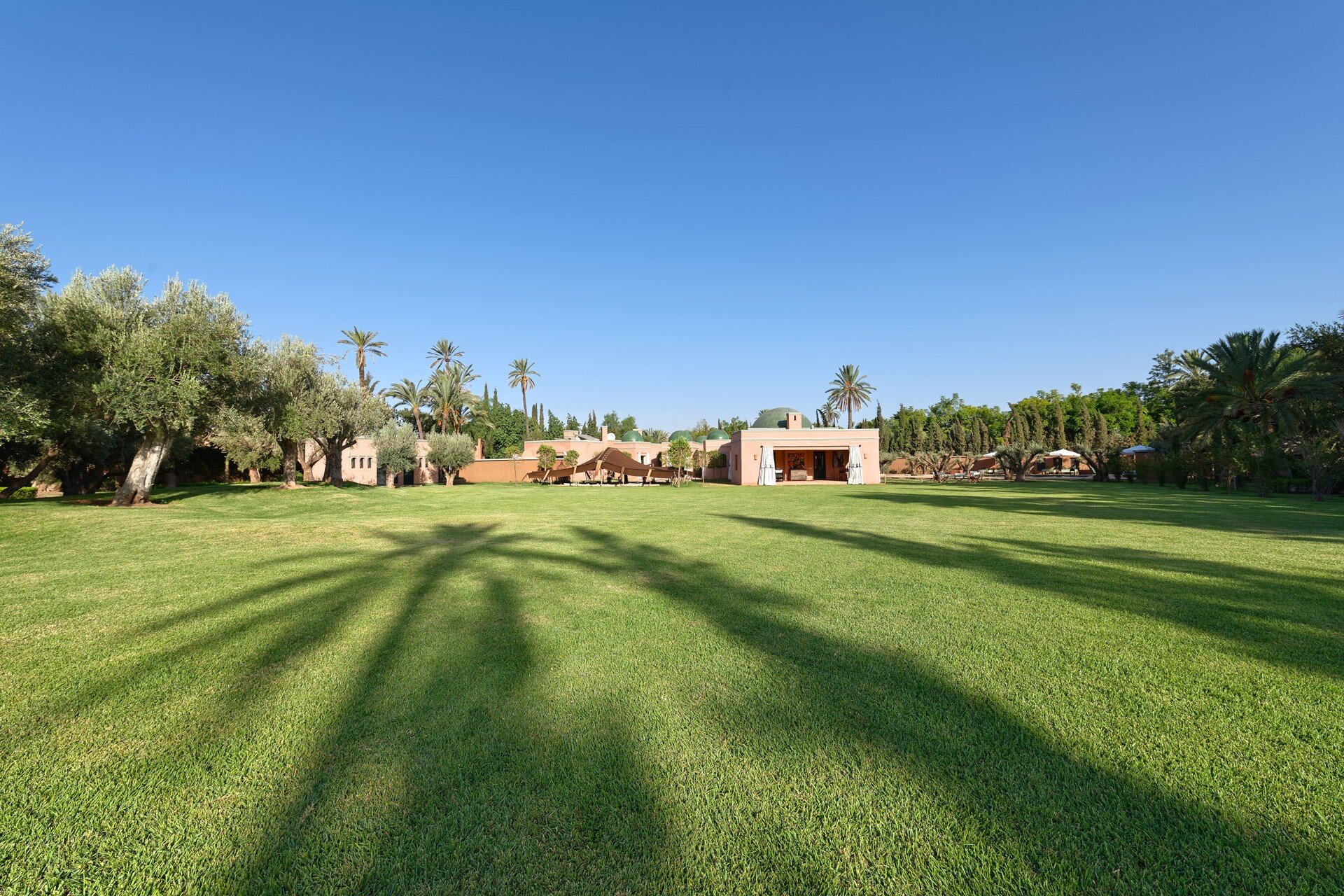 Facade of property showing berber tent and pool area to right