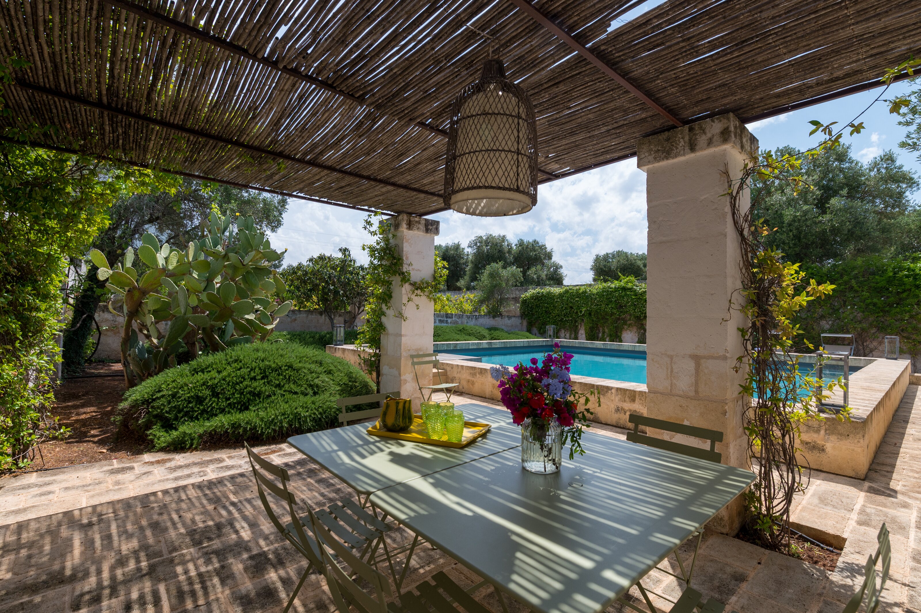 Shaded pergola by pool